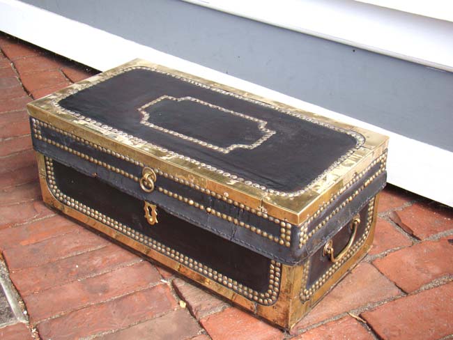 A diminutive China Trade black leather covered and brass studded chest circa 1840
